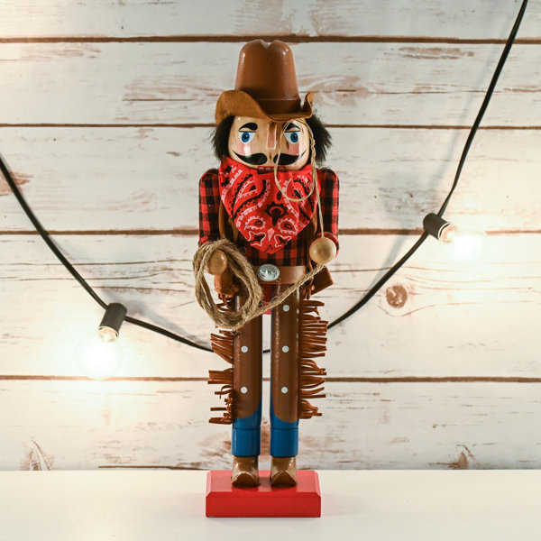 The Holiday Aisle® Western Wooden Nutcracker with a Rope and Lasso